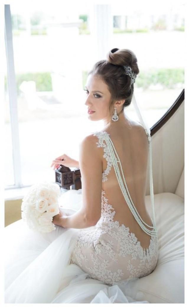 wedding photo - Backless wedding dress decorated with floral patterns