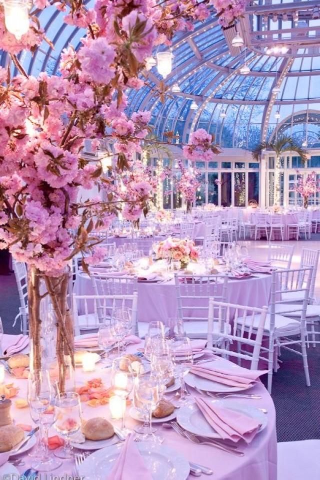 wedding photo - Spacious Wedding Decor with pink colored blossoms.