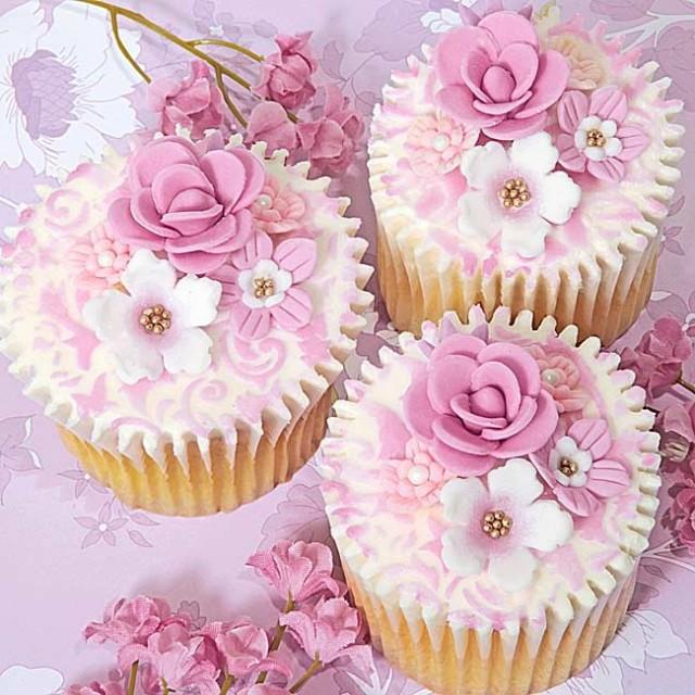 Pink and white wedding cupcakes with flowers