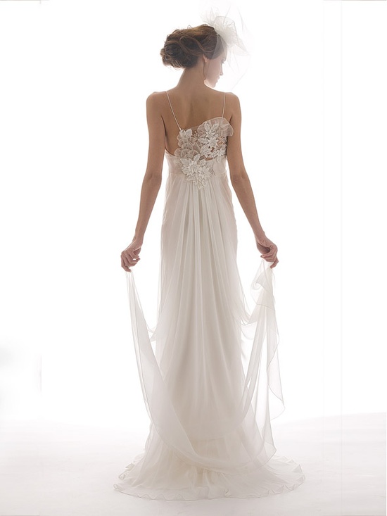 Wedding - Sleeveless white dress decorated with flower laces