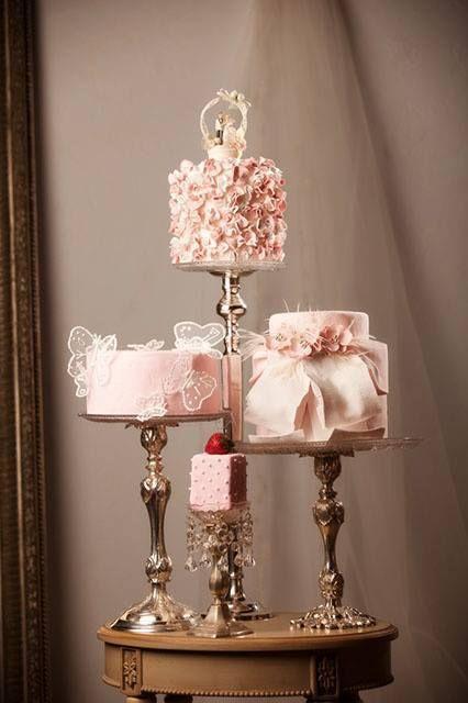 Hochzeit - Pink Wedding Cakes On Multilevel Stands. 