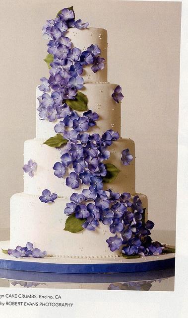 Wedding - Wedding cake with purple colored blossoms.