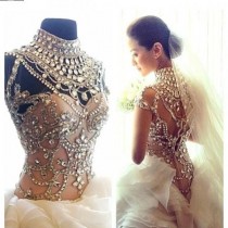 wedding photo - Ivory wedding dress heavily embellished with pearls